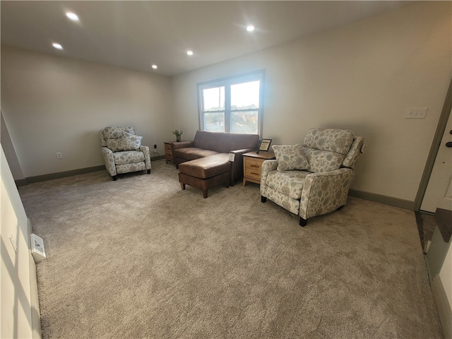 living area featuring carpet floors