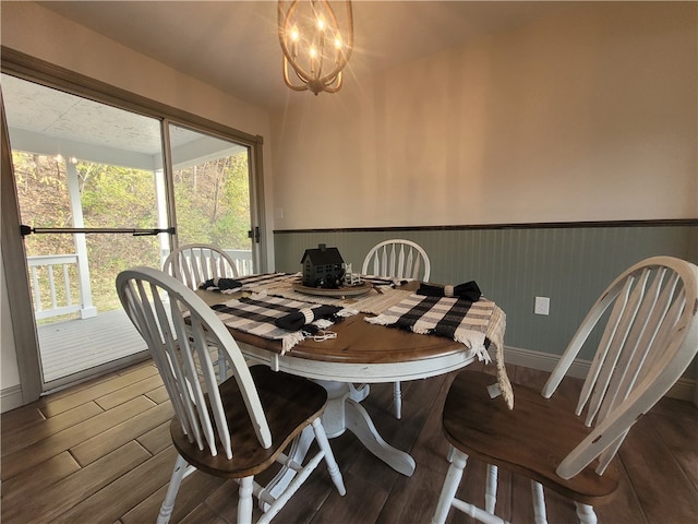 dining area with a chandelier and hardwood / wood-style floors