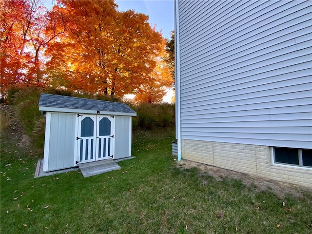 view of outdoor structure featuring a lawn