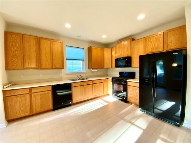 kitchen featuring black appliances and sink