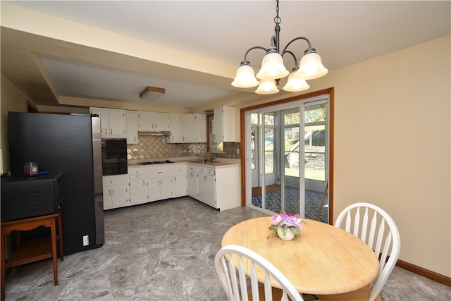 interior space with sink and a chandelier