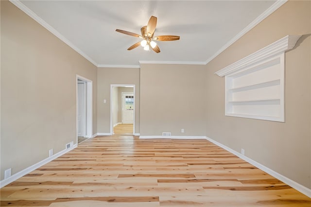 unfurnished room featuring ornamental molding, light wood-type flooring, and ceiling fan