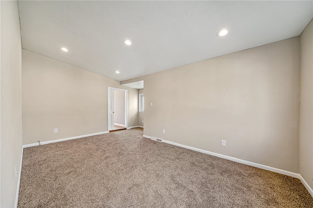 unfurnished room featuring carpet flooring