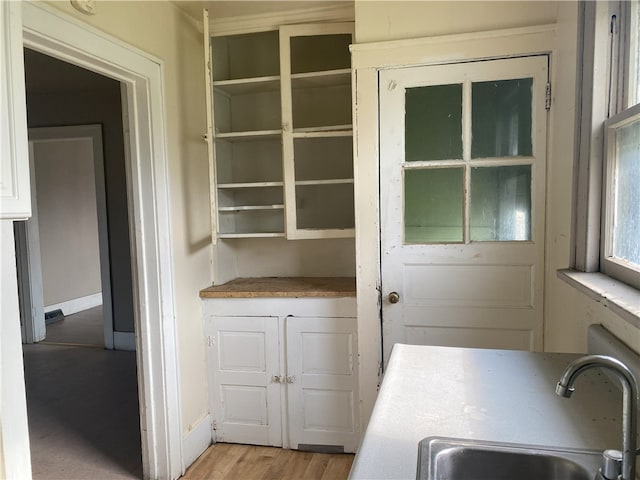 interior space with sink and light wood-type flooring