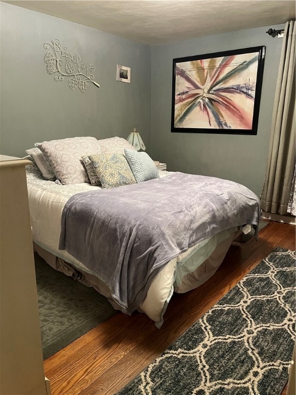 bedroom featuring dark hardwood / wood-style floors