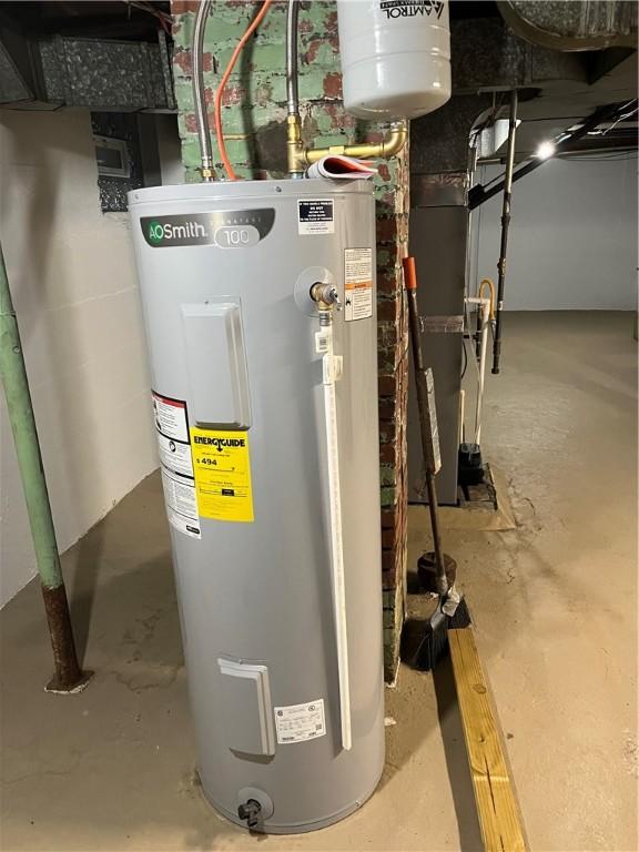 utility room with electric water heater