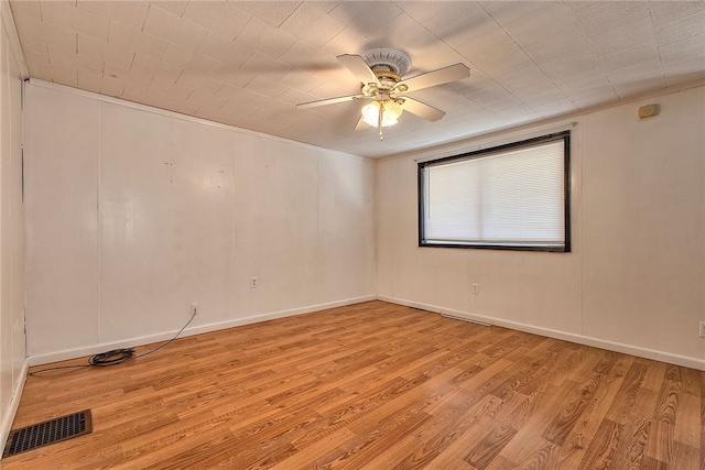 unfurnished room featuring crown molding, light hardwood / wood-style flooring, and ceiling fan