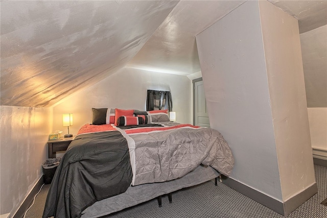 bedroom with lofted ceiling and carpet flooring