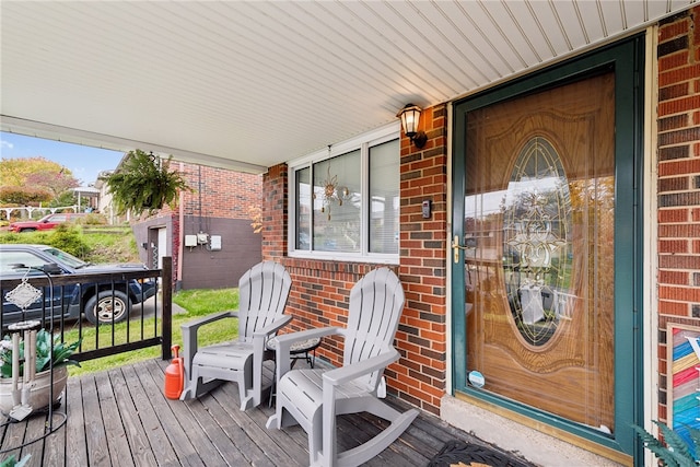 wooden terrace with a porch