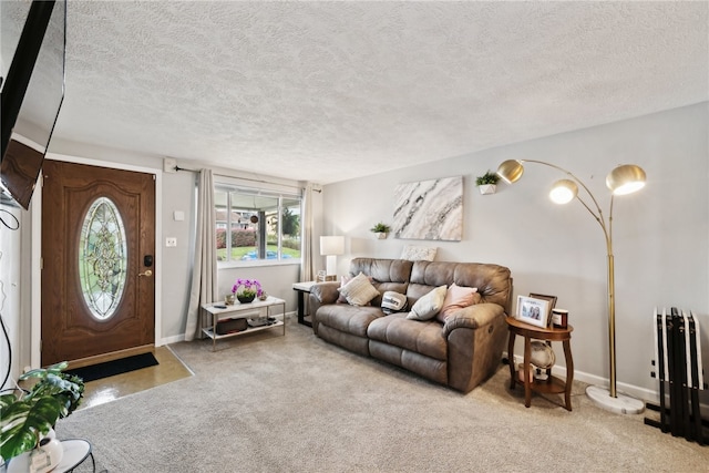 carpeted living room featuring a textured ceiling