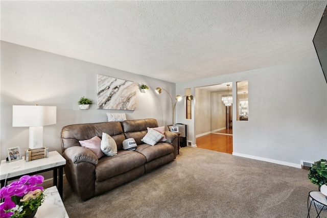 carpeted living room with a textured ceiling