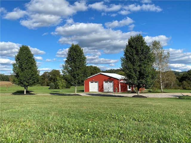 view of yard with an outbuilding and a garage