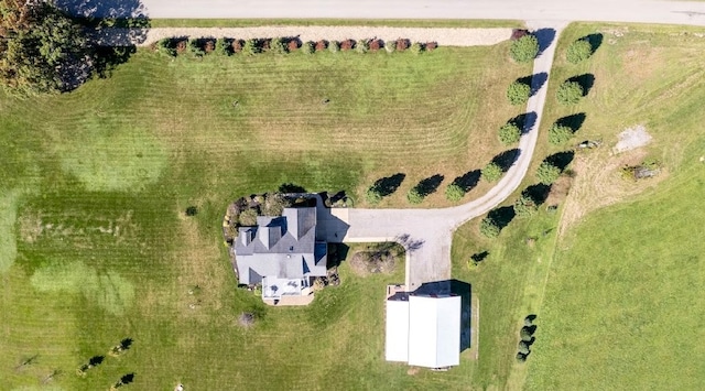 birds eye view of property with a rural view