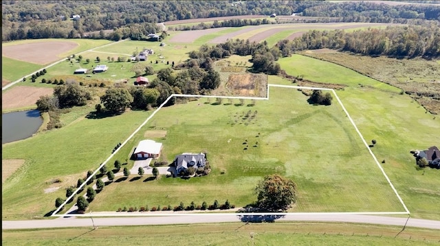 aerial view with a rural view and a water view