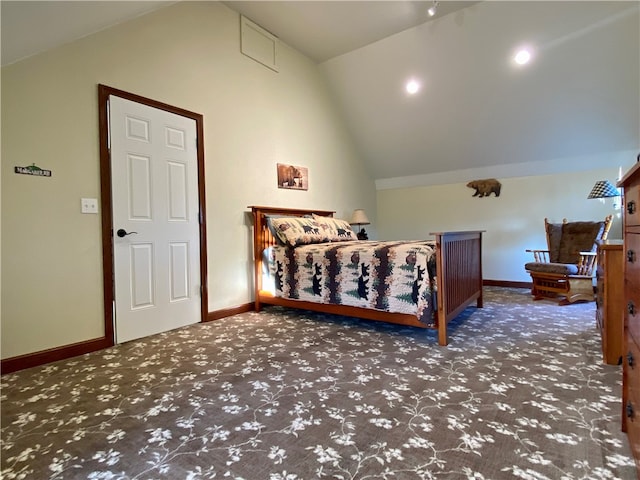 bedroom with vaulted ceiling and dark colored carpet