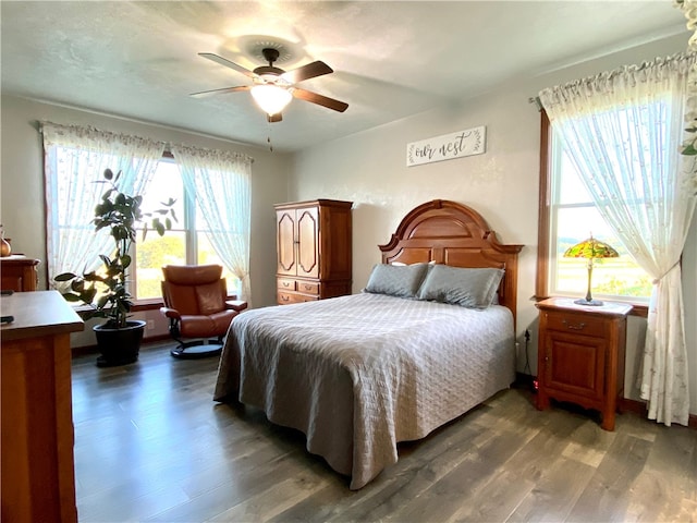 bedroom featuring dark wood-type flooring and ceiling fan