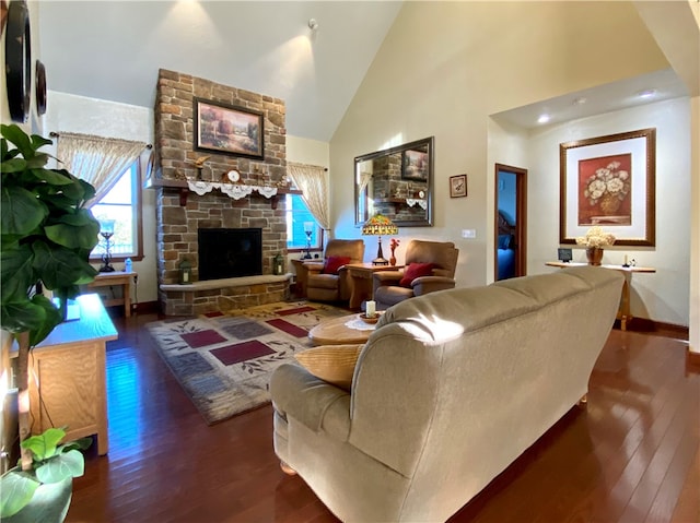 living room with a stone fireplace, high vaulted ceiling, and dark hardwood / wood-style flooring