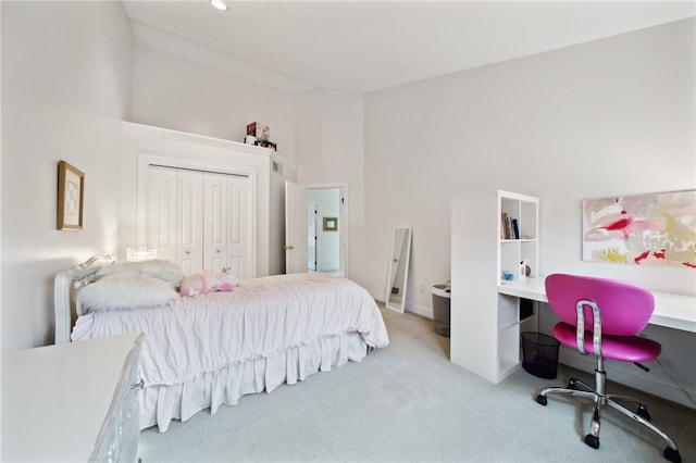 bedroom with a closet and carpet floors