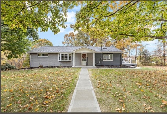 single story home featuring a front yard