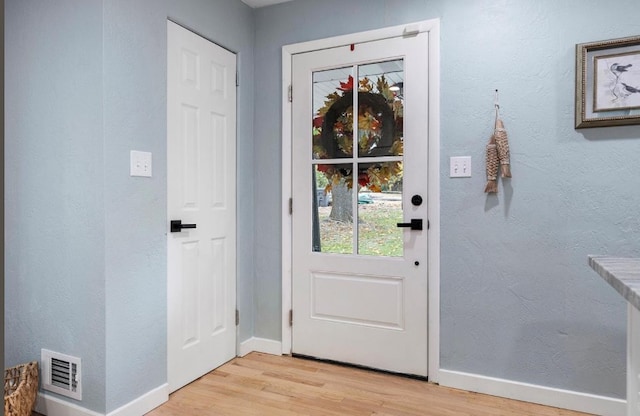 doorway to outside featuring light hardwood / wood-style floors