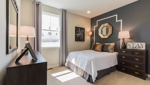 bedroom with light carpet, recessed lighting, visible vents, and baseboards