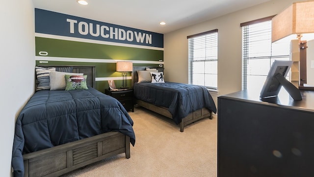 bedroom with light carpet and recessed lighting