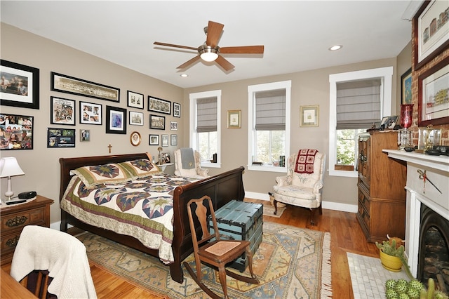 bedroom with hardwood / wood-style flooring and ceiling fan