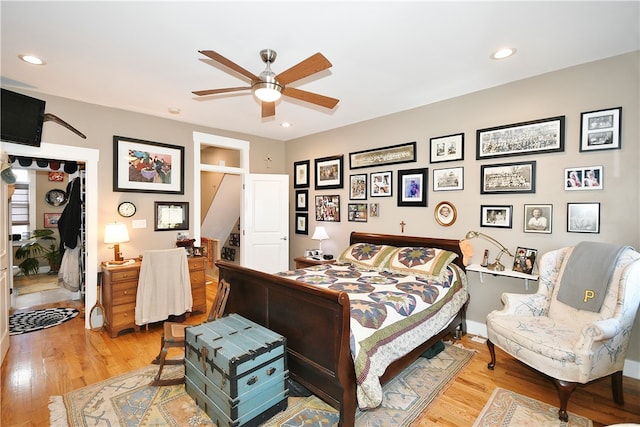 bedroom featuring ceiling fan and wood-type flooring