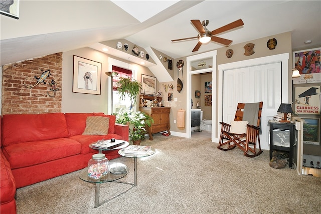 carpeted living room with lofted ceiling and ceiling fan