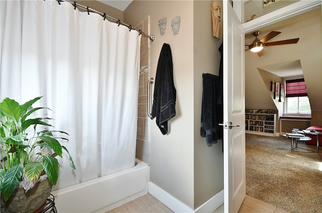 bathroom with shower / bath combo and ceiling fan