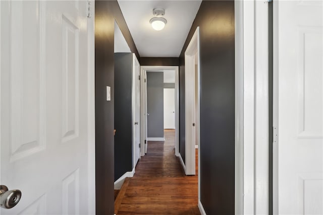 hallway featuring dark hardwood / wood-style flooring