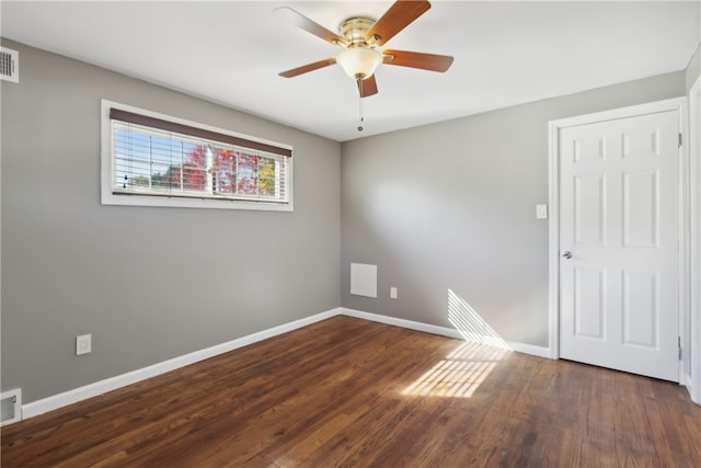 unfurnished room featuring ceiling fan and dark hardwood / wood-style floors