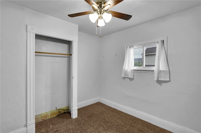 unfurnished bedroom with a closet, ceiling fan, and carpet flooring