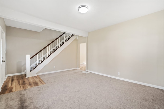 unfurnished living room with carpet flooring