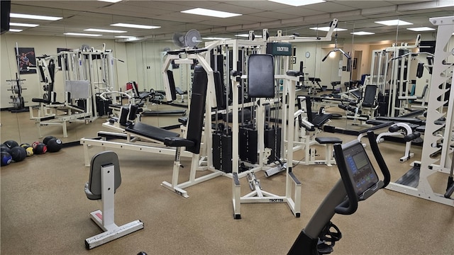 exercise room with a paneled ceiling