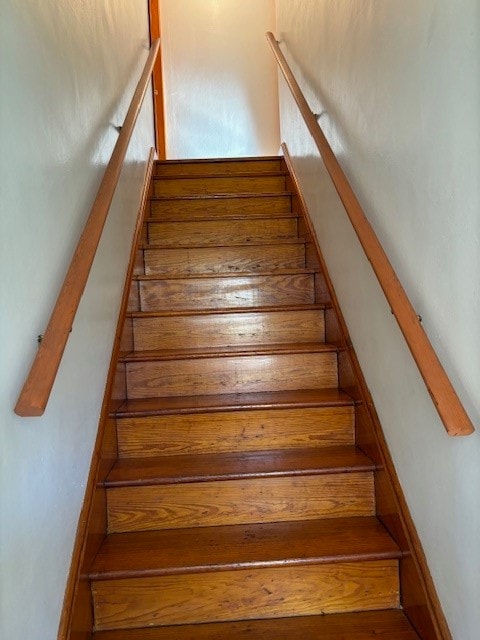 stairway with wood-type flooring