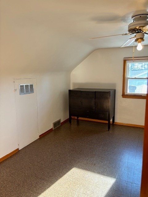 additional living space with ceiling fan and vaulted ceiling