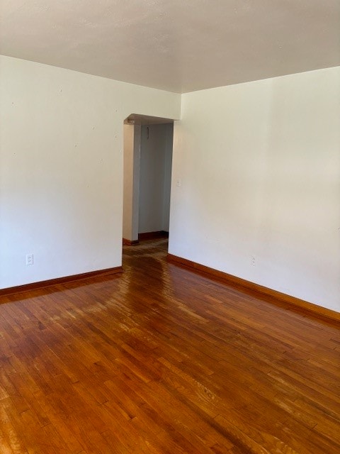 spare room featuring hardwood / wood-style flooring