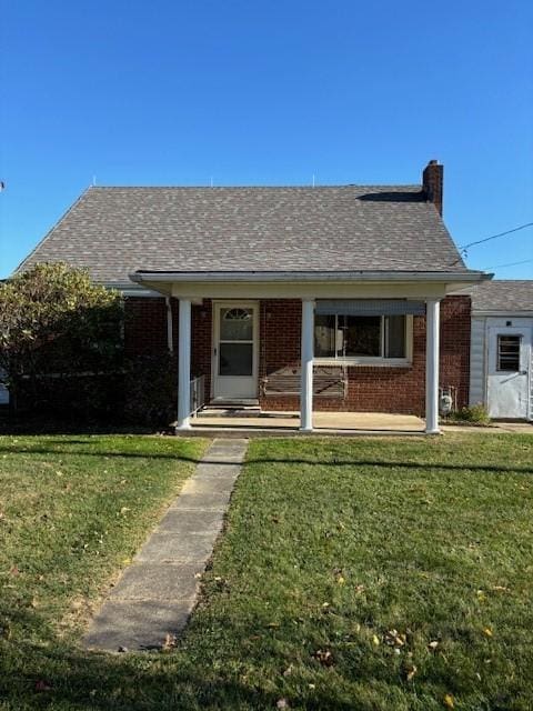 32 Elich Rd, Pa, PA 15021 - ranch-style house with brick siding, a front lawn, and a chimney