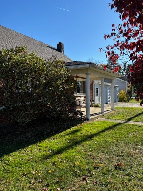 rear view of house featuring a yard