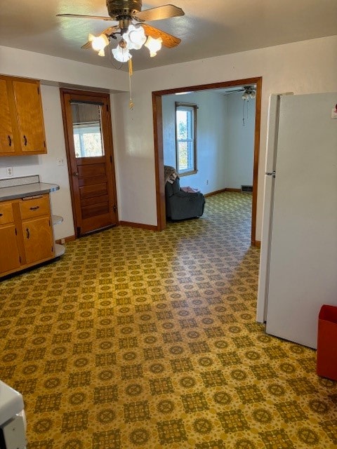 kitchen featuring white fridge and ceiling fan