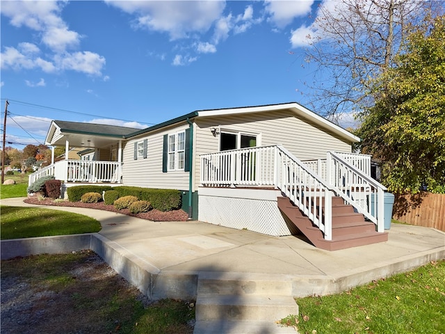 view of property exterior with a porch