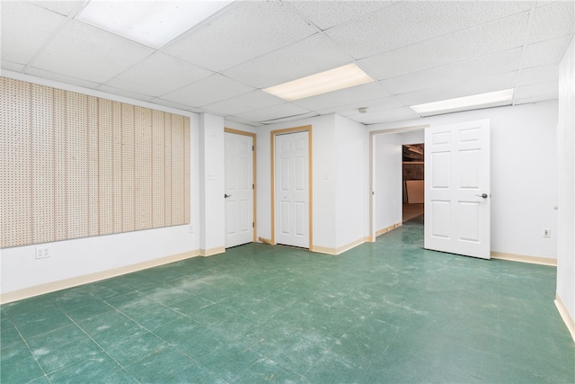 basement featuring a drop ceiling