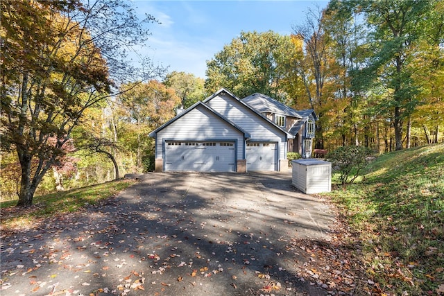 view of property exterior with a garage