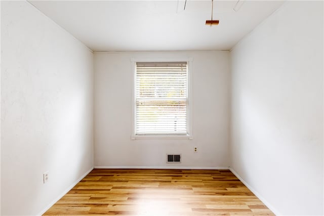 empty room with light wood-type flooring