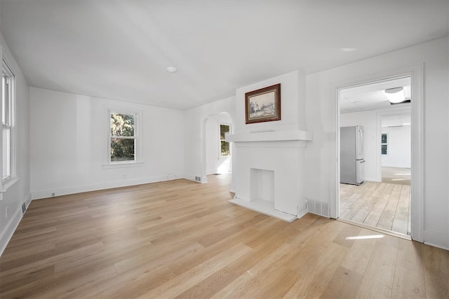 unfurnished living room with light hardwood / wood-style floors