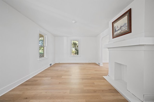 unfurnished living room featuring light hardwood / wood-style floors