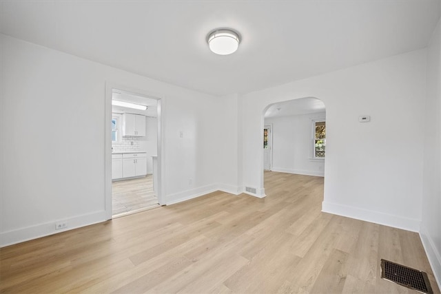 unfurnished room featuring light wood-type flooring