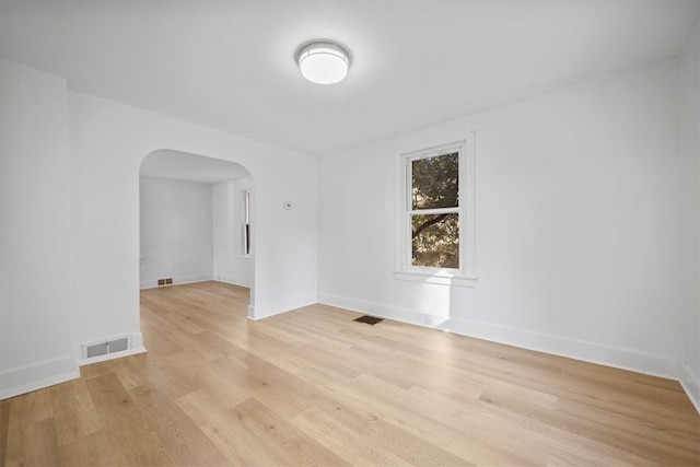 spare room featuring light hardwood / wood-style flooring