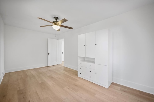 unfurnished bedroom featuring light hardwood / wood-style floors and ceiling fan